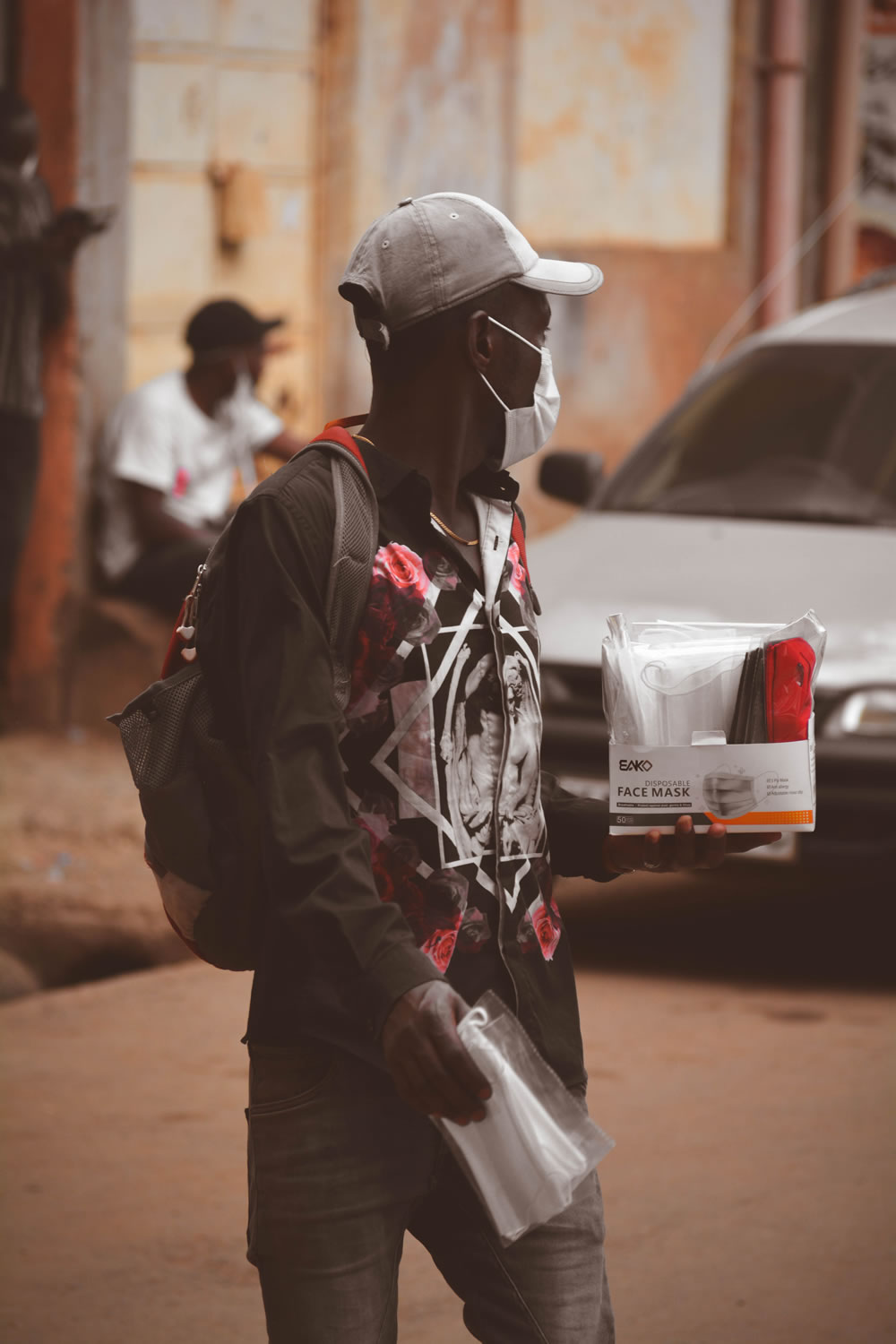 Due to high demand of facemasks necessitated by strick government regulations, many street vendors have taken to selling surgical masks to capitalize on the increasing demand for the facemasks. Above a street vendor selling his wares in Thika Town