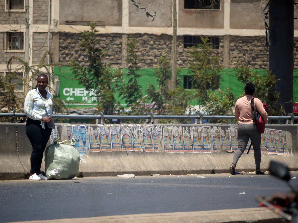 A roadside barrier littered with posters along Jogoo road including aspirants from the August 2022 elections.