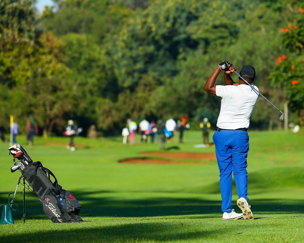 LEISURE – A man tees off at a resort where golf has grown increasingly popular, bringing in more enthusiasts, players, and followers.